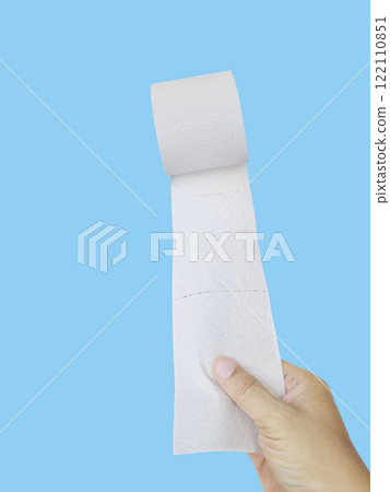Hand Holding a Roll of Toilet Paper on blue background 122110851