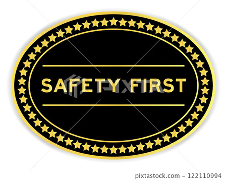 Black and gold color oval label sticker with word safety first on white background Black and gold color oval label sticker with word safety first on white background 122110994