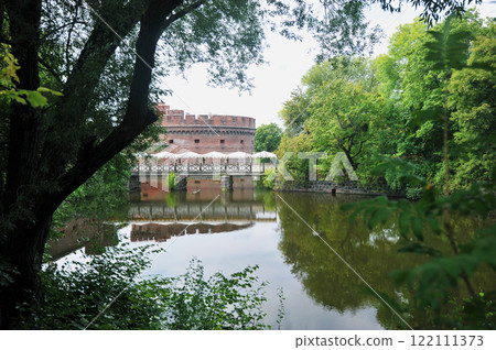 view of the ancient fortress and lake in Kaliningrad view of the ancient fortress and lake in Kaliningrad 122111373