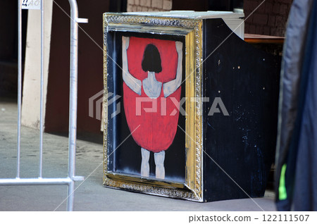 a painting in a gold frame with a cabaret dancer in the courtyard of Moscow 122111507