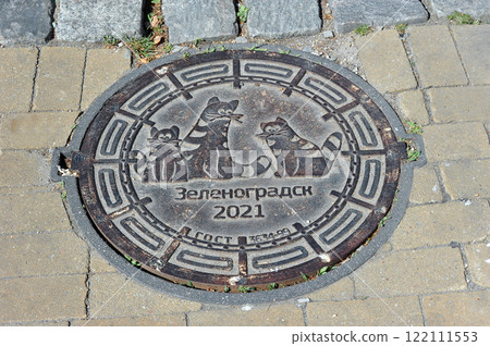 a manhole with a picture of cats on the street in Zelenogradsk a manhole with a picture of cats on the street in Zelenogradsk 122111553