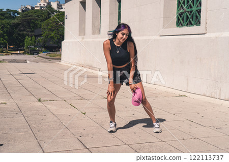 A young woman dancing in the street. A young woman dancing in the street. 122113737