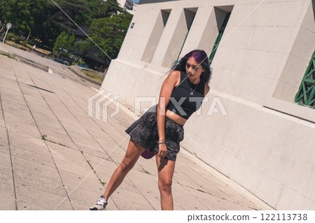 A young woman dancing in the street. A young woman dancing in the street. 122113738