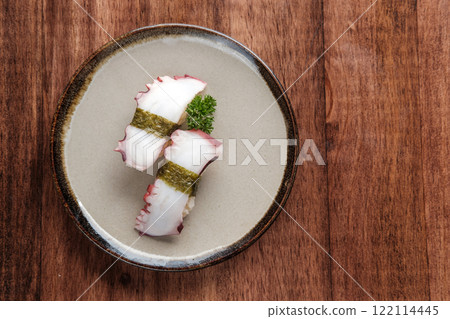 Tako Nigiri on a Round Plate 122114445
