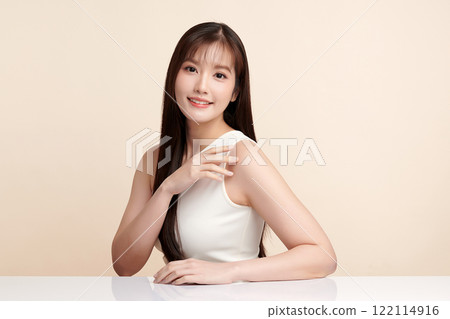 Beautiful young asian woman with clean fresh skin on beige background, Face care, Facial treatment, Cosmetology, beauty and spa, Asian women portrait. Beautiful young asian woman with clean fresh skin on beige background, Face care, Facial treatment, Cosmetology, beauty and spa, Asian women portrait. 122114916