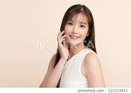 Beautiful young asian woman with clean fresh skin on beige background, Face care, Facial treatment, Cosmetology, beauty and spa, Asian women portrait. 122114921