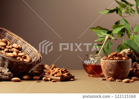 Almond nuts and honey on a brown background. Almond nuts and honey on a brown background. 122115168