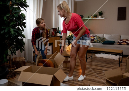 Unpacking Family Moments Delightful Kids and Parents Sharing Quality Time Together Unpacking Family Moments Delightful Kids and Parents Sharing Quality Time Together 122115355