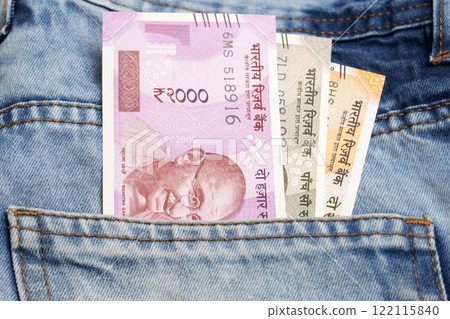 Indian rupee in the pocket of blue jeans 122115840