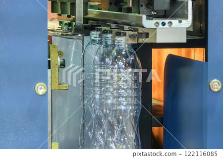 The drinking water bottle manufacturing process by blow mold machine. The drinking water bottle manufacturing process by blow mold machine. 122116085