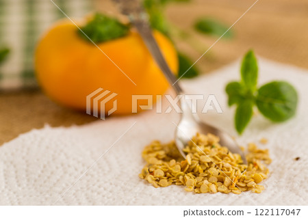 yellow pepper seeds on wooden table yellow pepper seeds on wooden table 122117047