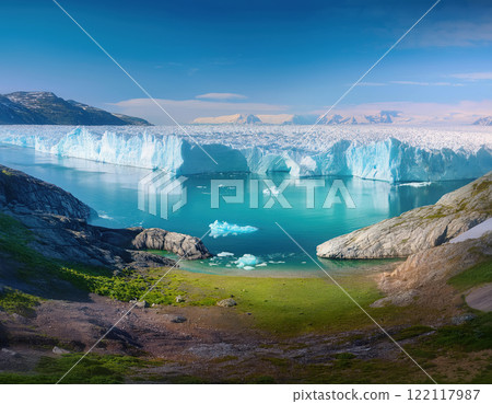 Arctic scene with molten icebergs at Earth poles. Greenland or Antarctica ice melting due of global warming and climate changes shows terrain patches and hidden ores underneath the glacier desert 122117987
