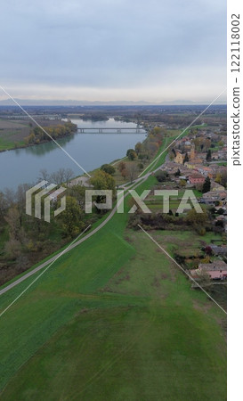 Po river flowing near san nazzaro, monticelli d'ongina, italy, aerial view Po river flowing near san nazzaro, monticelli d'ongina, italy, aerial view 122118002