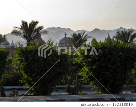 Domes of the entertainment complex against the background of mountains in the sky haze. Alf Leila Wa Leila, Sharm El Sheikh, Egypt 122118019