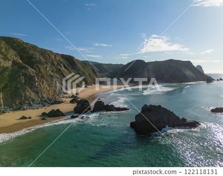 Adraga Beach and Cliffs on Sunny Day. Atlantic Ocean, Portugal. Aerial View 122118131