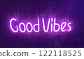 A purple neon sign on a dark surface reads "Good Vibes". Concept of positive messaging. 122118525
