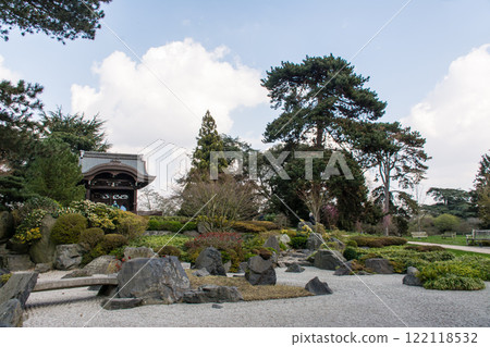 A Japanese garden surrounded by trees including a rock garden and an Imperial Gate at Kew Gardens in the outskirts of London A Japanese garden surrounded by trees including a rock garden and an Imperial Gate at Kew Gardens in the outskirts of London 122118532
