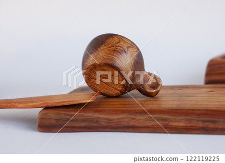 Wooden kitchen utensils stacked view Wooden kitchen utensils stacked view 122119225