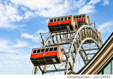 Ferris wheel with red cabins of the Prater amusement park in Vienna, Austria. Ferris wheel with red cabins of the Prater amusement park in Vienna, Austria. 122119597