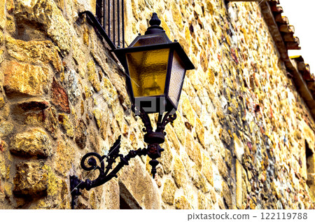 Photo centered on the charm of the lampposts forged in the town of Pals de Girona Photo centered on the charm of the lampposts forged in the town of Pals de Girona 122119788