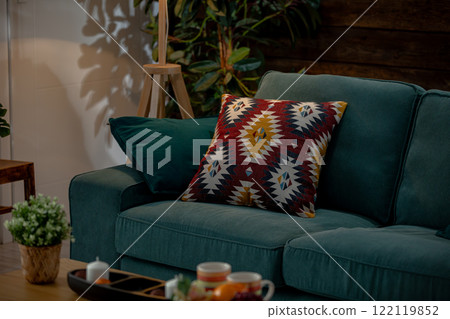 A Cozy Living Room Featuring a Colorful Decorative Pillow That Enhances the Ambiance A Cozy Living Room Featuring a Colorful Decorative Pillow That Enhances the Ambiance 122119852
