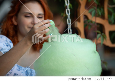 Savoring the Delight of Sweet and Fluffy Cotton Candy at an Exciting FunFilled Event 122119862