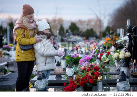 A Peaceful Memorial Gathering at a Cemetery, Surrounded by Beautiful Flowers and Family 122120633