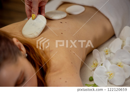 Experience relaxation with our luxurious Hot Stones Massage, perfect for body and mind Experience relaxation with our luxurious Hot Stones Massage, perfect for body and mind 122120659