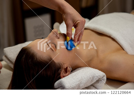 Experience a Revitalizing and Relaxing Facial Treatment Enhanced with Blue Tool Application 122120664