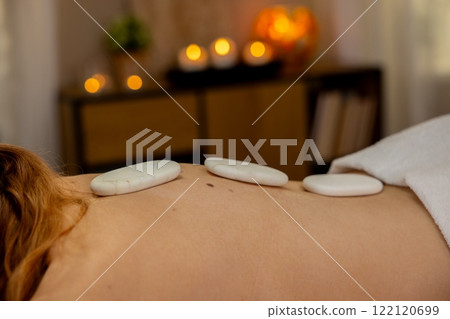 Enjoy the soothing benefits of a Hot Stone Massage for ultimate wellness and tranquility Enjoy the soothing benefits of a Hot Stone Massage for ultimate wellness and tranquility 122120699