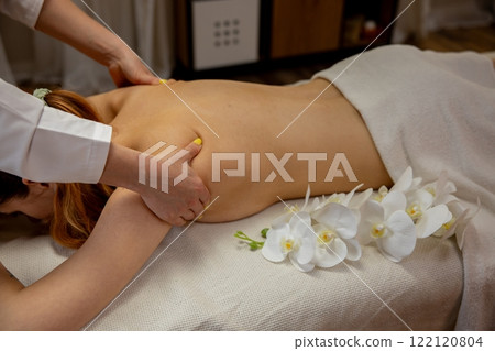 Enjoy a Relaxing and Rejuvenating Massage Therapy Session Enhanced by Fresh Flowers 122120804