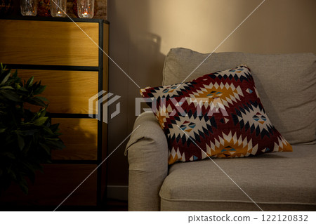 A Cozy and Inviting Living Room Showcasing an Artistic Cushion Gracefully Laid on the Sofa 122120832