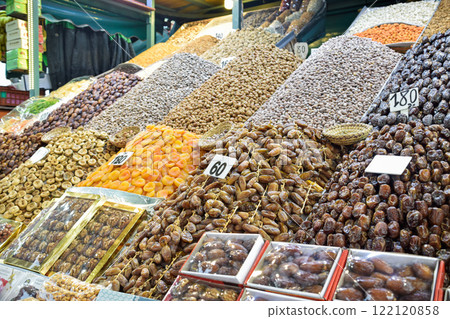 Dates, apricots, almonds and snacks displayed in business of Marrakech square Dates, apricots, almonds and snacks displayed in business of Marrakech square 122120858