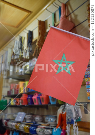 Flag of Morocco with the background of souvenir shop in Marrakech. 122120872
