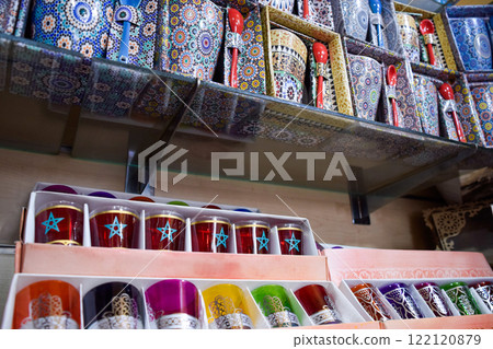 Colorful tea glasses displayed in a souvenir shop in Marrakech. 122120879