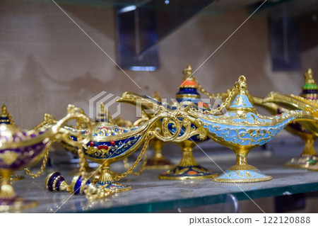 Small decorative oil lamps displayed in a souvenir shop in Marrakech. 122120888