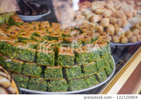 Typical baklava and almond sweets. Pastries stocked on Marrakesh market Typical baklava and almond sweets. Pastries stocked on Marrakesh market 122120904