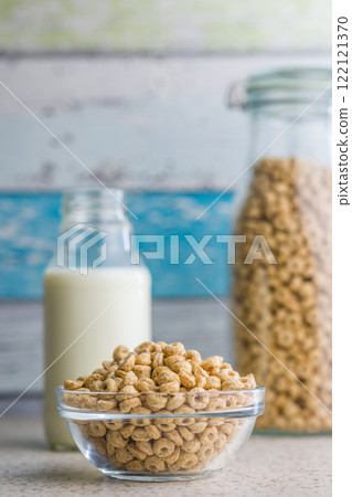 Sweet honey cereal rings in bowl on klitchen table. 122121370