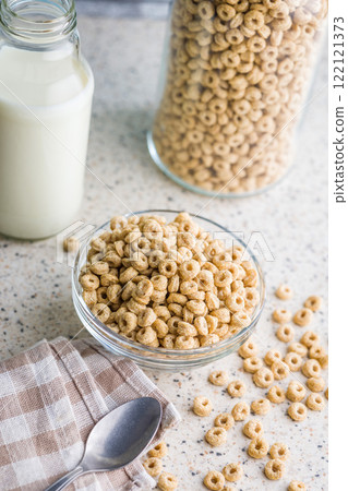 Sweet honey cereal rings in bowl on klitchen table. Sweet honey cereal rings in bowl on klitchen table. 122121373