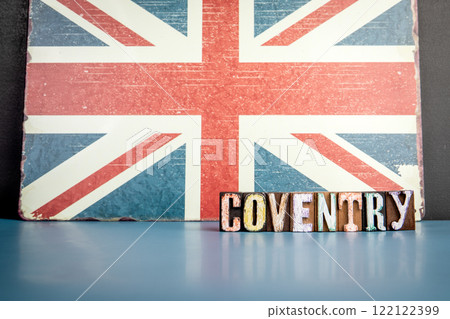 COVENTRY. Urban Area in Great Britain. Flag and alphabet letters on wooden texture background COVENTRY. Urban Area in Great Britain. Flag and alphabet letters on wooden texture background 122122399