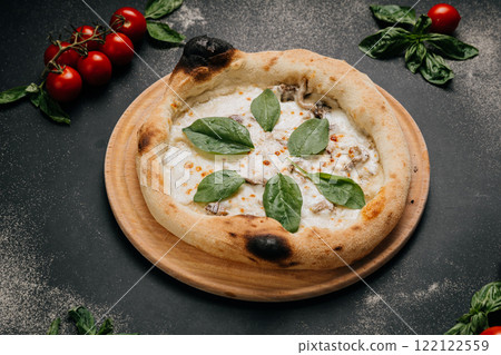 Gourmet white pizza with creamy mozzarella, mushrooms, and fresh spinach on a rustic wooden plate Gourmet white pizza with creamy mozzarella, mushrooms, and fresh spinach on a rustic wooden plate 122122559