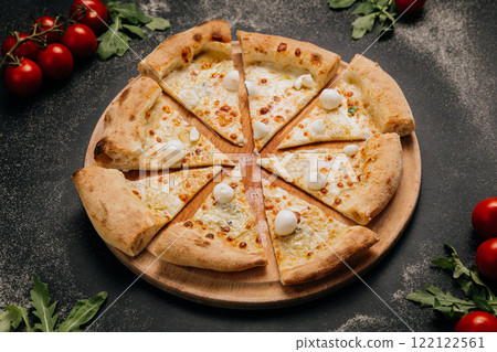 Sliced mozzarella pizza with golden crust, ideal for gourmet food lovers and culinary photography Sliced mozzarella pizza with golden crust, ideal for gourmet food lovers and culinary photography 122122561