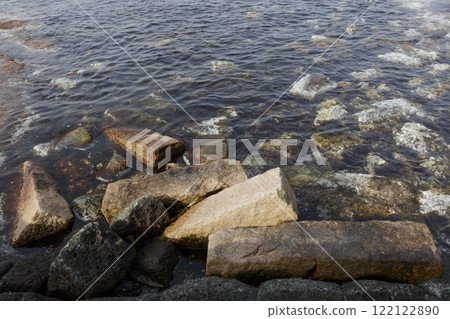 Old stone pillars in the sea Old stone pillars in the sea 122122890