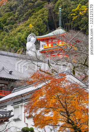 View of the Great Jizo Statue and the three-story pagoda Reimeiden from the approach to Chogosonshiji Temple on Mount Shigi View of the Great Jizo Statue and the three-story pagoda Reimeiden from the approach to Chogosonshiji Temple on Mount Shigi 122123170