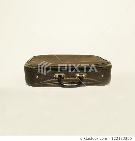 A Vintage Leather Suitcase with a Classic Design Set Against a Neutral Background Setting A Vintage Leather Suitcase with a Classic Design Set Against a Neutral Background Setting 122123390