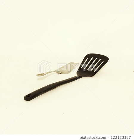 Essential Kitchen Utensils Spatula and Turner designed for effective Cooking and Food Preparation Essential Kitchen Utensils Spatula and Turner designed for effective Cooking and Food Preparation 122123397