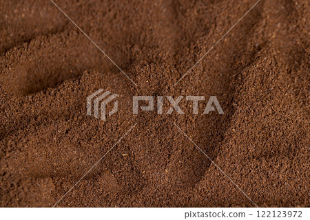 a large amount of ground coffee powder close up a large amount of ground coffee powder close up 122123972