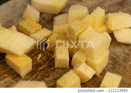 diced soft ripe pumpkin of orange color, fresh pumpkin for cooking diced soft ripe pumpkin of orange color, fresh pumpkin for cooking 122123995
