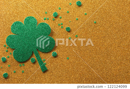 Happy St Patrick's Day decoration concept made from shamrocks ( clover leaf) on golden background. Happy St Patrick's Day decoration concept made from shamrocks ( clover leaf) on golden background. 122124099