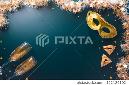 Happy Purim carnival decoration concept made from golden mask star and glitter on dark background. (Happy Purim in Hebrew, jewish holiday celebrate) 122124102